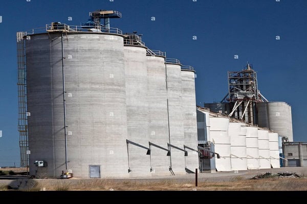 “Large rice storage facility with high stacks of grain bags representing record foodgrain stocks in India’s Central Pool.”